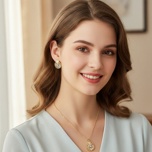 Woman wearing gold earrings and necklace indoors