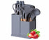 Gray kitchen utensil holder with utensils and strawberries on a white background