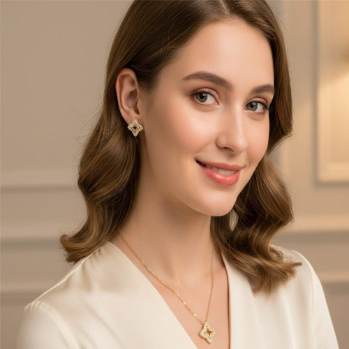 Woman wearing a necklace and earrings with a neutral background