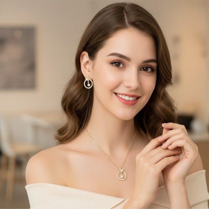 Woman wearing a necklace and earrings in an indoor setting