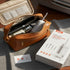 Portable oral laryngoscope with accessories and packaging on a textured surface